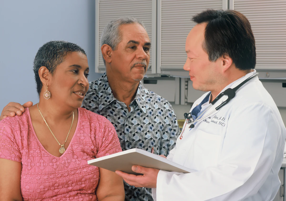Doctor reviewing results with a couple